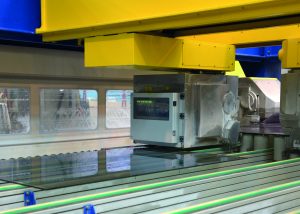 Machine cutting glass demonstrates how Industry 4.0 affects glass manufacturers